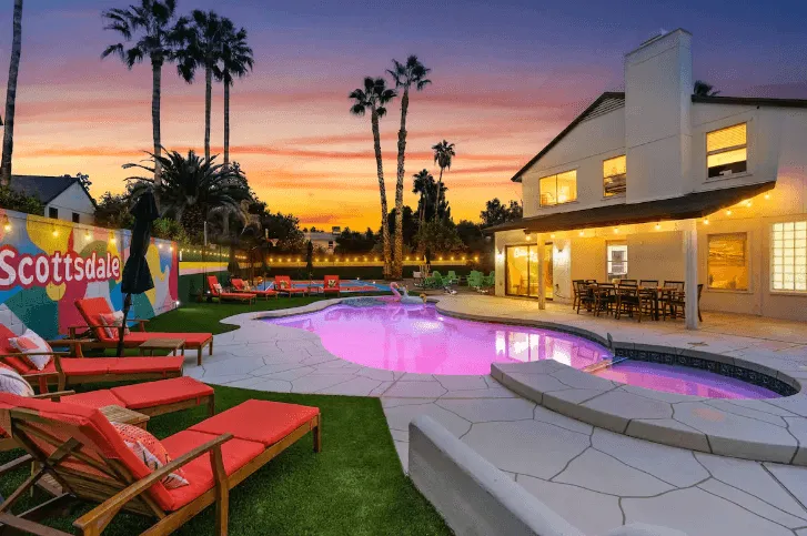 Backyard of a modern house at sunset.